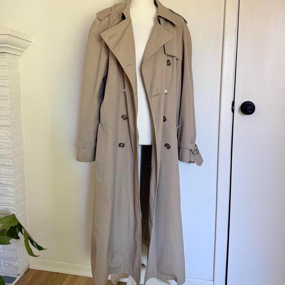 London Fog tan trench coat with double-breasted buttons and belted waist
